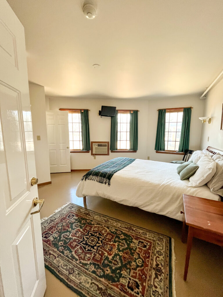 A cozy 2nd-floor Unit #8 with a queen bed and private bath with shower