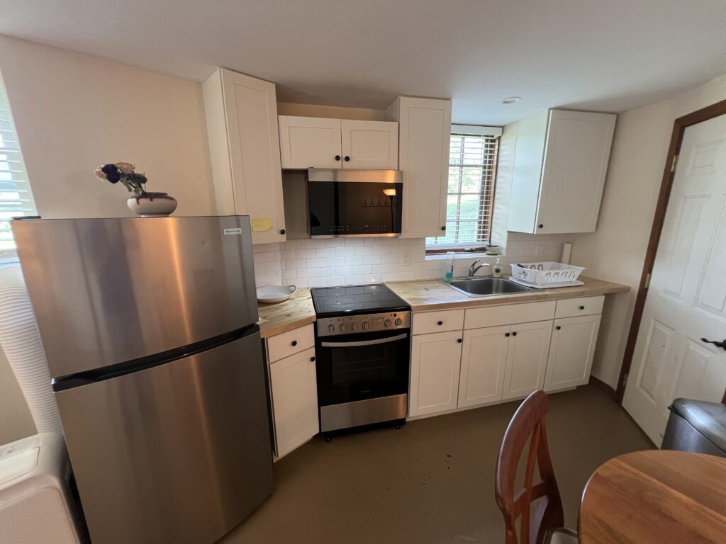 Studio #15 with a queen bed, full kitchen & private bath